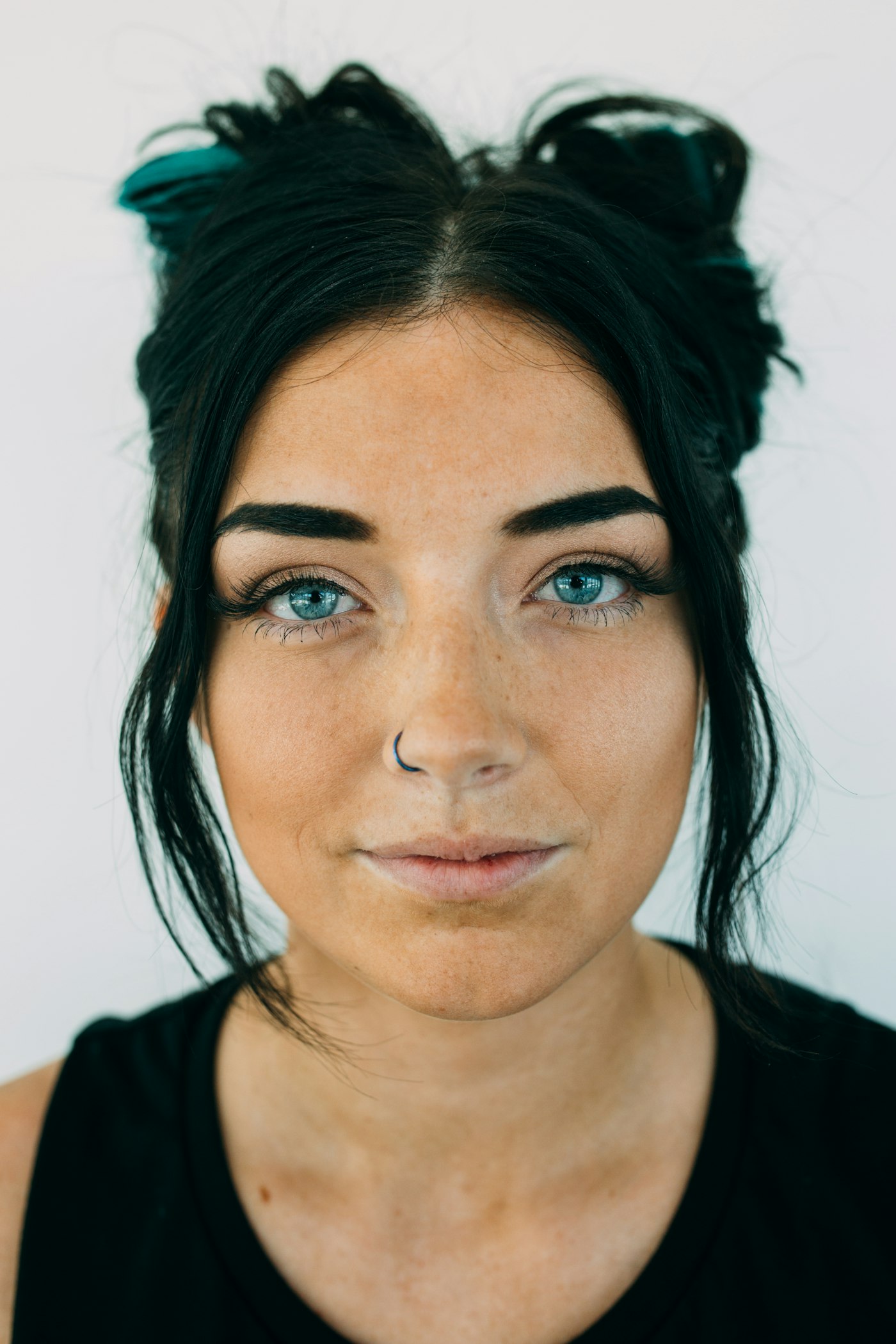 A woman with thick dark hair facing the camera